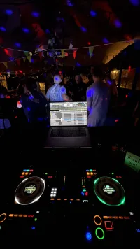 A photo of DJ decks in a nightclub