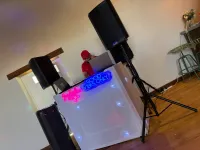 Jon standing behind decks at an event